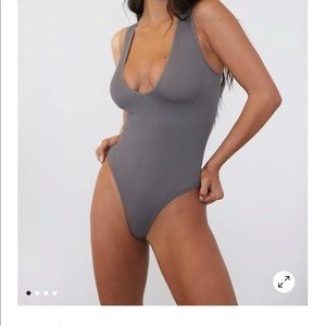 Black body suit urban outfitters. NEVER WORN